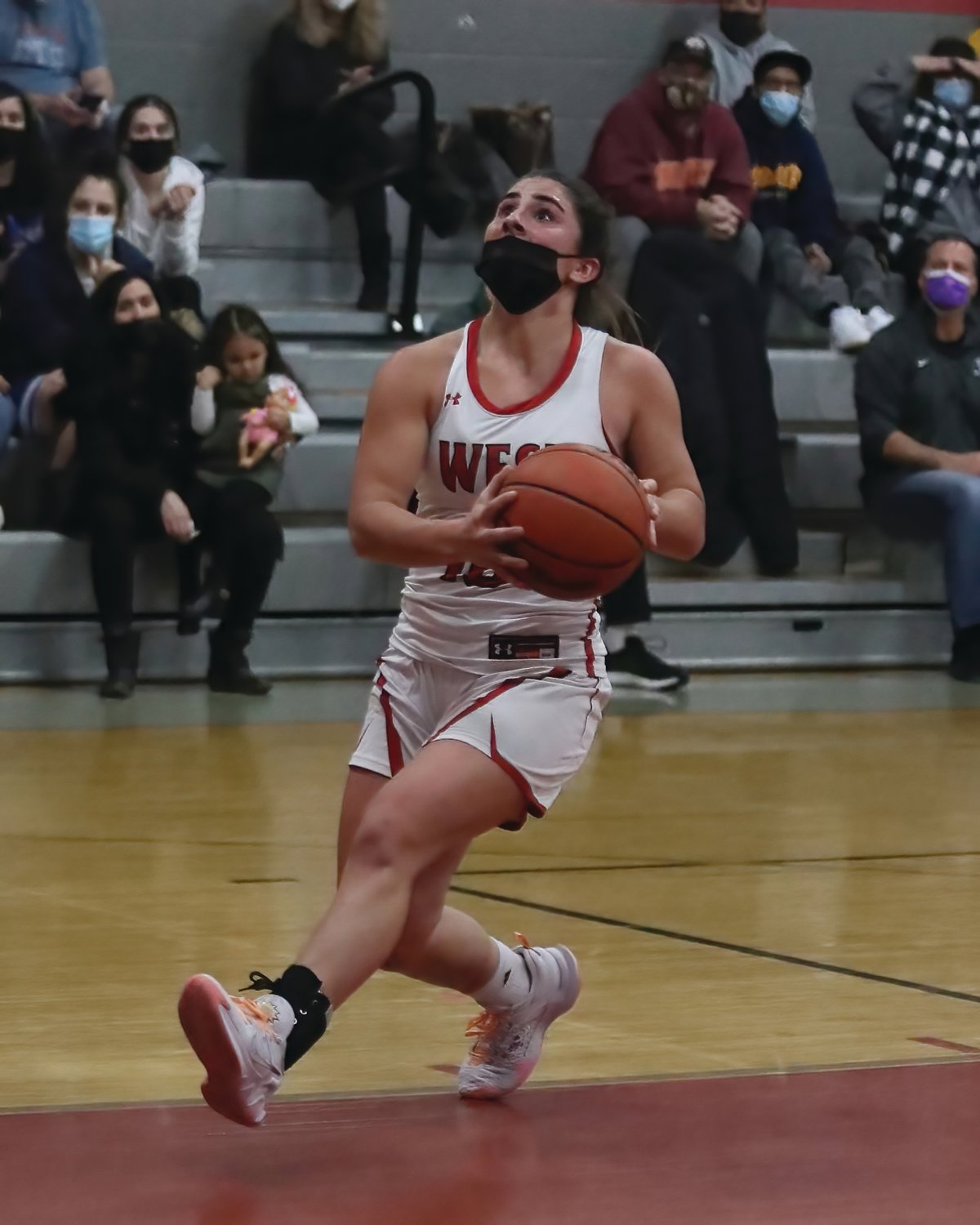 PLAYOFF PUSH:
Cranston West’s Maddie
Alves drives to the basket
against North Kingstown
last week. The Falcons split
their games last weekend
to remain in the playoff picture
and are looking to
make a strong push as they
enter the back half of their
regular season slate. (Photos
by Mike Zawistoski
